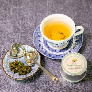 Orange spice tea in a blue cup.